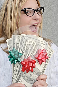 Cheerful woman with Holiday money