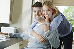 Cheerful Woman Hugging Man From Behind