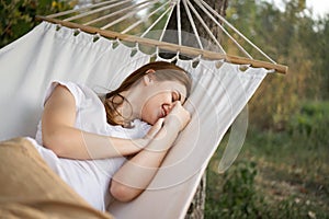 cheerful woman lies in a hammock rest nature fresh air
