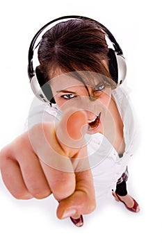 Cheerful woman listening to music in headphon