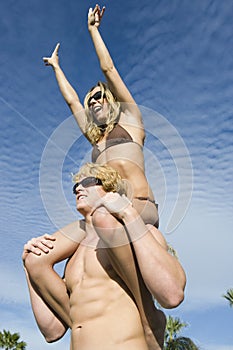 Cheerful Woman On Man's Shoulders