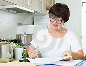 cheerful woman paying bills