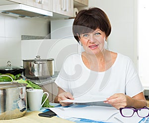 cheerful woman paying bills