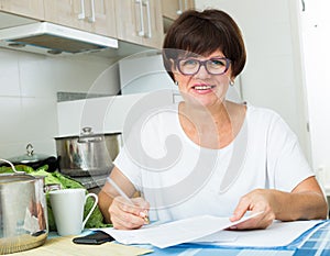 cheerful woman paying bills