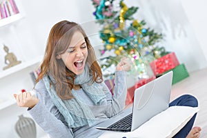 Cheerful woman with raised fists winning concept