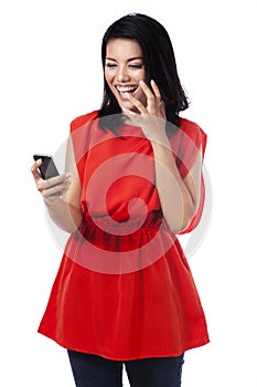 Cheerful woman read a message on the phone