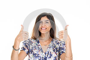 Cheerful woman showing two thumbs up fingers proud victory in white background