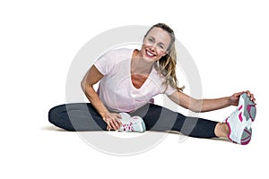 Cheerful woman touching toes while exercising