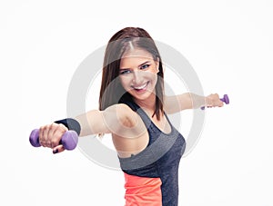 Cheerful woman working out with dumbbells