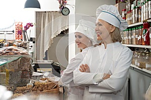 Cheerful women selling nuts and pastry