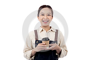 Cheerful young asian woman barista in casual work attire happily holding a takeaway coffee cup.