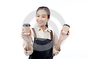 Cheerful young asian woman barista in casual work attire happily holding a takeaway coffee cup.