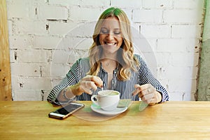 Cheerful young business woman on her coffee break