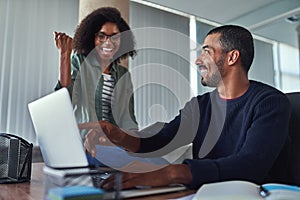 Cheerful young businesswoman celebrating their success