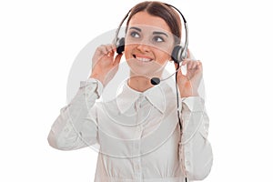 Cheerful young call center office girl with headphones and microphone smiling isolated on white background