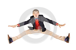 Cheerful young casual man jumping in air