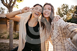 Cheerful young caucasian woman in good mood spend leisure time outdoors together.