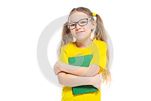 Cheerful young child girl with glasses holding a book to study isolated on a white background.