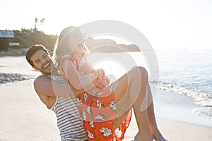 Cheerful young couple enjoying at beach