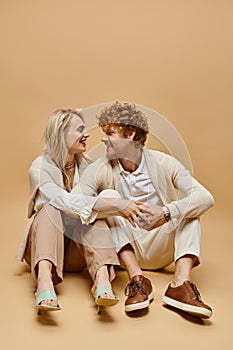 cheerful young couple in light-colored