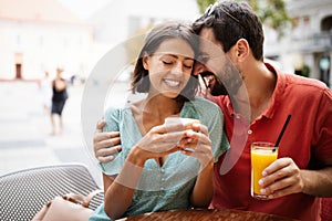 Cheerful young couple on a romantic date in a cafe.