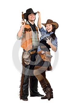 Cheerful young cowboy and cowgirl