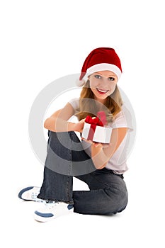 Cheerful young girl with Christmas present