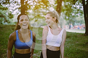 Cheerful young girl sporty girl laughing and talking together at park,Happy and smiling,Relaxing time