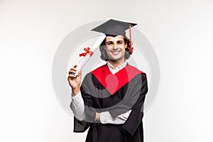 Cheerful young graduated student man isolated on white background