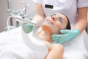 Young woman smiling during the oxygen meso therapy photo