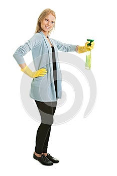 Cheerful young lady spraying cleaner liquid