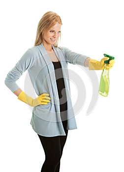 Cheerful young lady spraying cleaner liquid