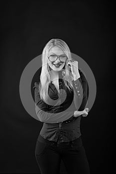 Cheerful young lady with straight hair in eyewear and blouse