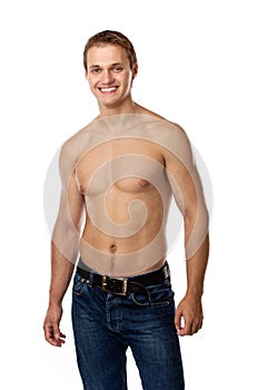 Cheerful young man in jeans with bare torso photo