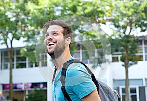 Cheerful young man smiling with bag