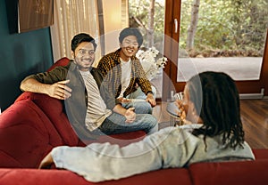 Cheerful young people is talking each other while having weekend home party together