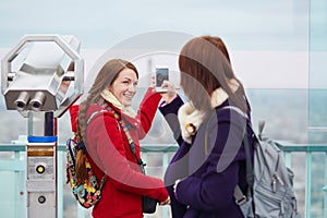 Cheerful young tourists on the Montparnasse tower