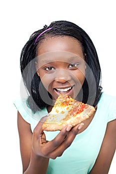 Cheerful young woman eating a pizza