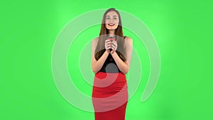 Cheerful young woman enjoying coffee on green screen