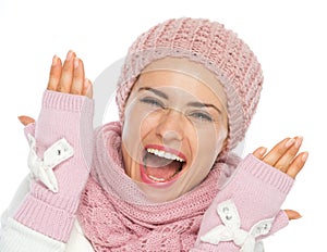 Cheerful young woman in knit winter clothing