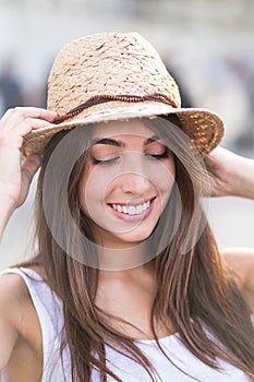 Cheerful young woman looking down