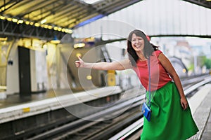 Cheerful young woman in Parisian underground