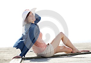 Cheerful young woman relaxing at beach