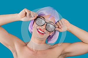 Cheerful young woman in glamour glasses