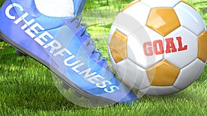 Cheerfulness and a life goal - pictured as word Cheerfulness on a football shoe to symbolize that Cheerfulness can impact a goal photo