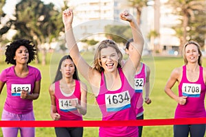 Cheering blonde winning breast cancer marathon