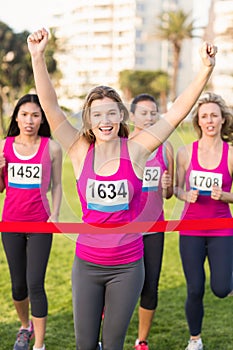 Cheering blonde winning breast cancer marathon