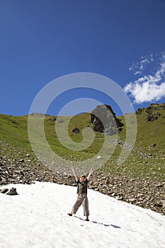 Cheering boy in a snowfield photo