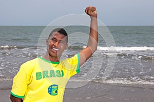 Cheering brazilian guy at beach