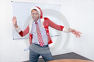 Cheering businessman in SantaÂ´s costume